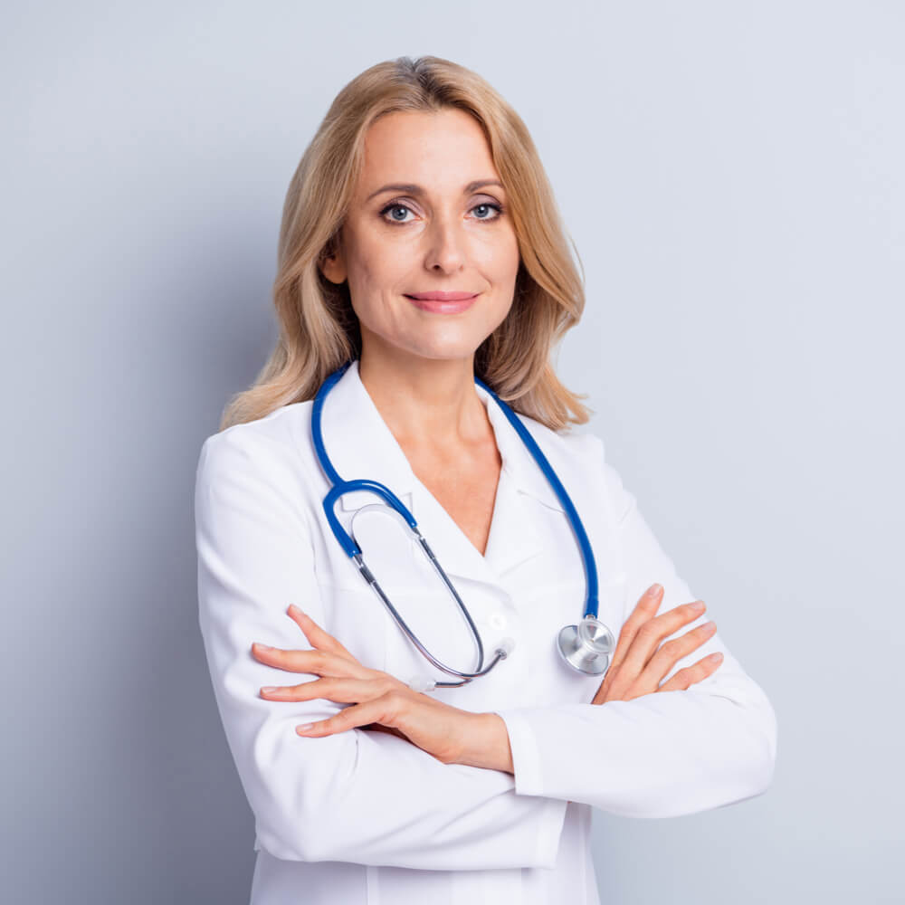 mature lady doctor wear white coat arms crossed